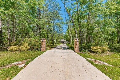 View of home's community featuring concrete drivew