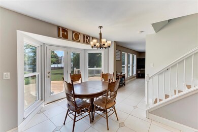 Breakfast room overlooking large deck and backyard