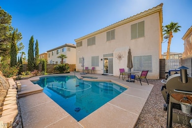View of swimming pool with a grill, a fenced backyard, a patio, and a pool with connected hot tub