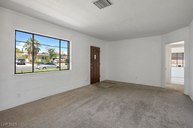 Unfurnished room with carpet and ornamental moldin