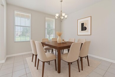 Dining area with light tile patterned flooring an