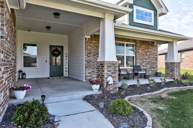 Doorway to property featuring covered porch