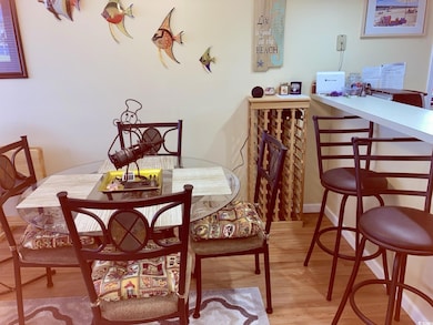 Dining area with hardwood / wood-style floors
