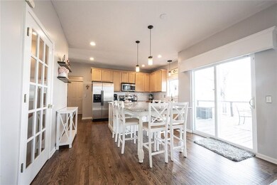Open kitchen with large island with breakfast bar