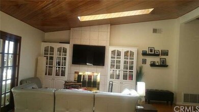 Living Room Fireplace View Showing Skylight