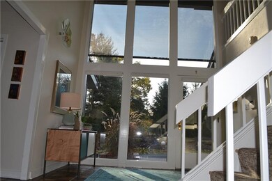 Enter into the dramatic 2 story foyer.