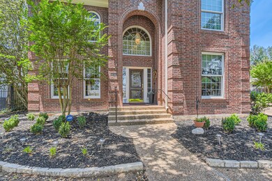 Doorway to property featuring brick siding