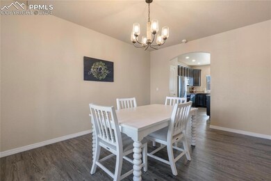 Dining area featuring an inviting chandelier and d