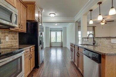 Amazing kitchen. Custom backsplash and nice granite.  Great for entertaining.