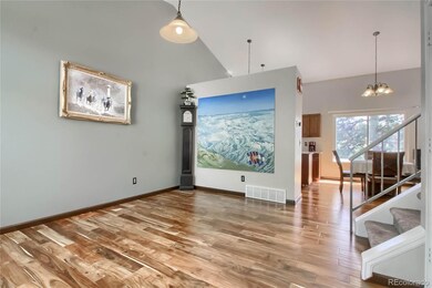 Beautiful hardwood floors and vaulted ceiling on m