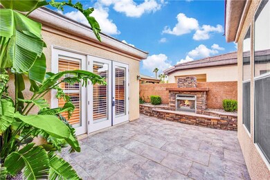 Additional patio at the side of the house with acc