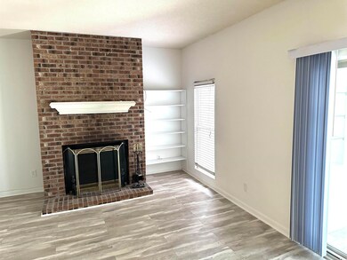 Unfurnished living room with hardwood / wood-style