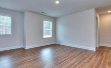 Unfurnished room with recessed lighting, baseboard