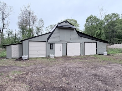 Pull through Garage and 1200+ sq. ft. Barn