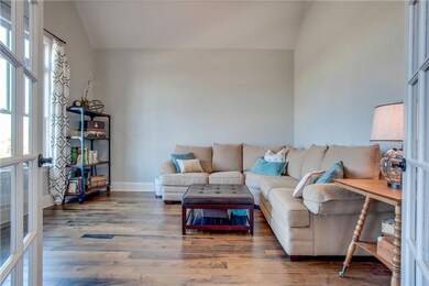 The Gathering Room off the Foyer has Elegant French Doors...this room could also be an office or  formal living room.
