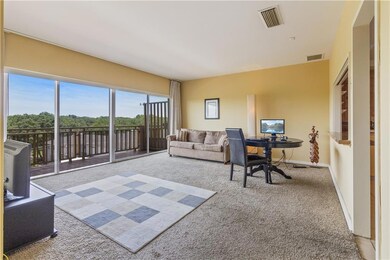 Living area with access to 34' tiled balcony