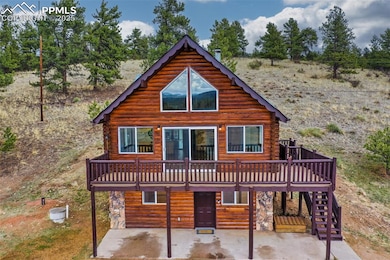 View of front of house with stairs, a patio area, 