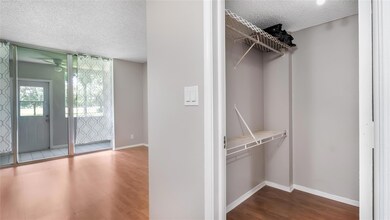 Walk-in closet in primary bedroom offers lots of s
