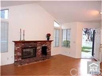 Notice the high ceilings and cozy fireplace!