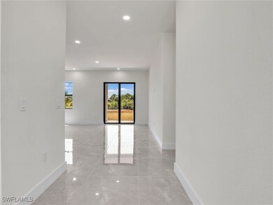 Hallway featuring baseboards and recessed lighting