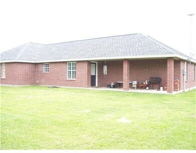Exterior Back. Enjoy a backyard barbeque with fami