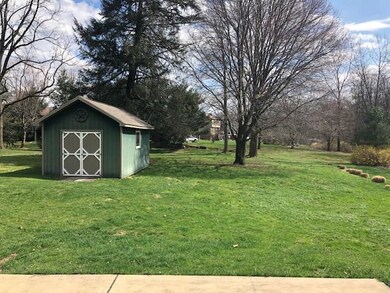 Beautiful homesite features mature trees and a she
