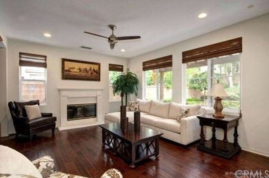 Spacious family room w/cozy fireplace, ceiling fan
