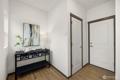 Three stories with spacious entry and lower level attached garage complete with EV Charging Station.