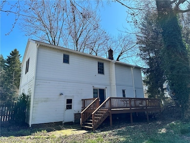 Rear view of house with a deck