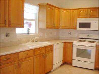 Kitchen. This kitchen has loads of cabinets for storage and all of the appliances stay.