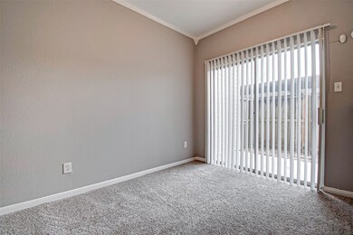 Dining or flex room opens to a private patio.