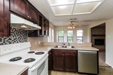 Kitchen with dishwasher, electric stove, under ca