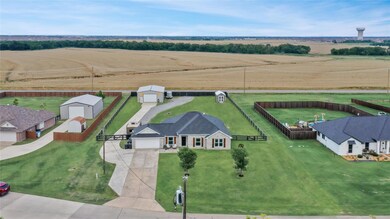 One acre homestead with 30x40 drive-thru workshop,
