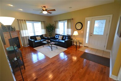 Family room with hardwood floor and gas fireplace