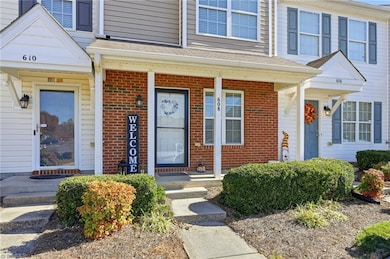 Front with brick & covered front porch