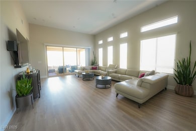 Living area with light wood-style flooring and bas