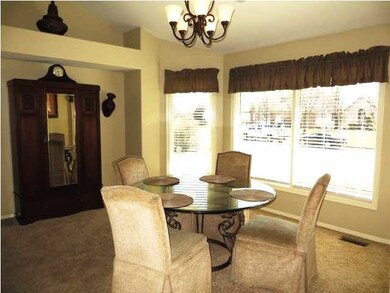 Formal dining are features a beautiful bay window