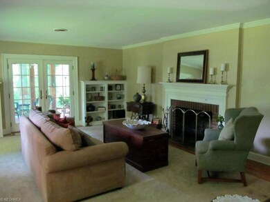 Spacious living room with wood burning fireplace, 