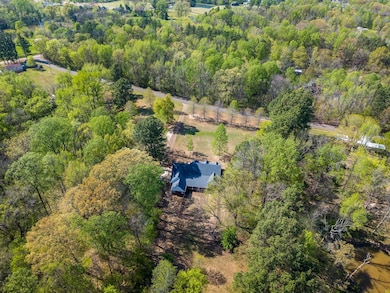 Drone / aerial view featuring a view of trees