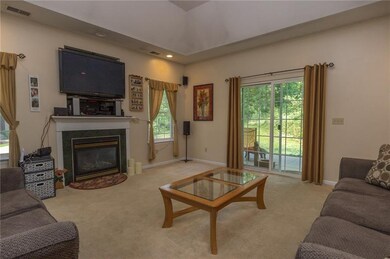 Living room with gas fireplace and access to a pri