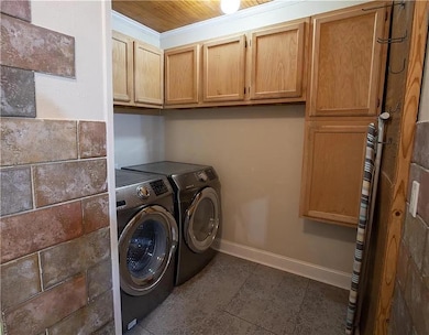Laundry room with cabinet space, washing machine 