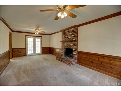 Spacious Great Room with fireplace, two ceiling fa