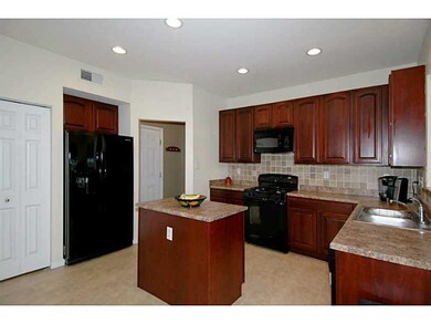 Kitchen. A mud room is conveniently located betwee