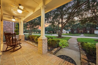 A large front porch is bordered by lush landscaping with morning shade creating the perfect spot to start the day. *Virtually staged