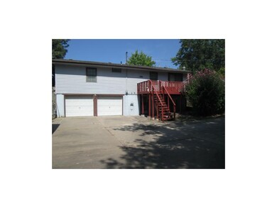 2 car garage.  Large concrete drive. Deck out of k