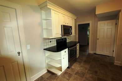 With a pantry, cabinetry, and all of the shelves, 