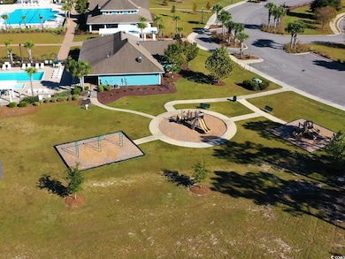 Drone / aerial view of a pool and a recreational park