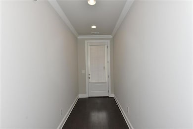 Doorway to outside with recessed lighting, baseboa