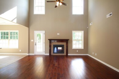EXAMPLE>>>Large Great Room with Fireplace, HIGH Ceiling, Hardwood Flooring and Lots of Natural Sunlight!!!