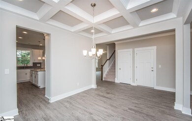 Formal Dining area with a lovely coffered ceiling